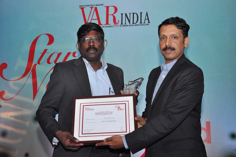 Mr. Anoop Nambiar,Director-BPO- IBM   giving away award to TVS-e